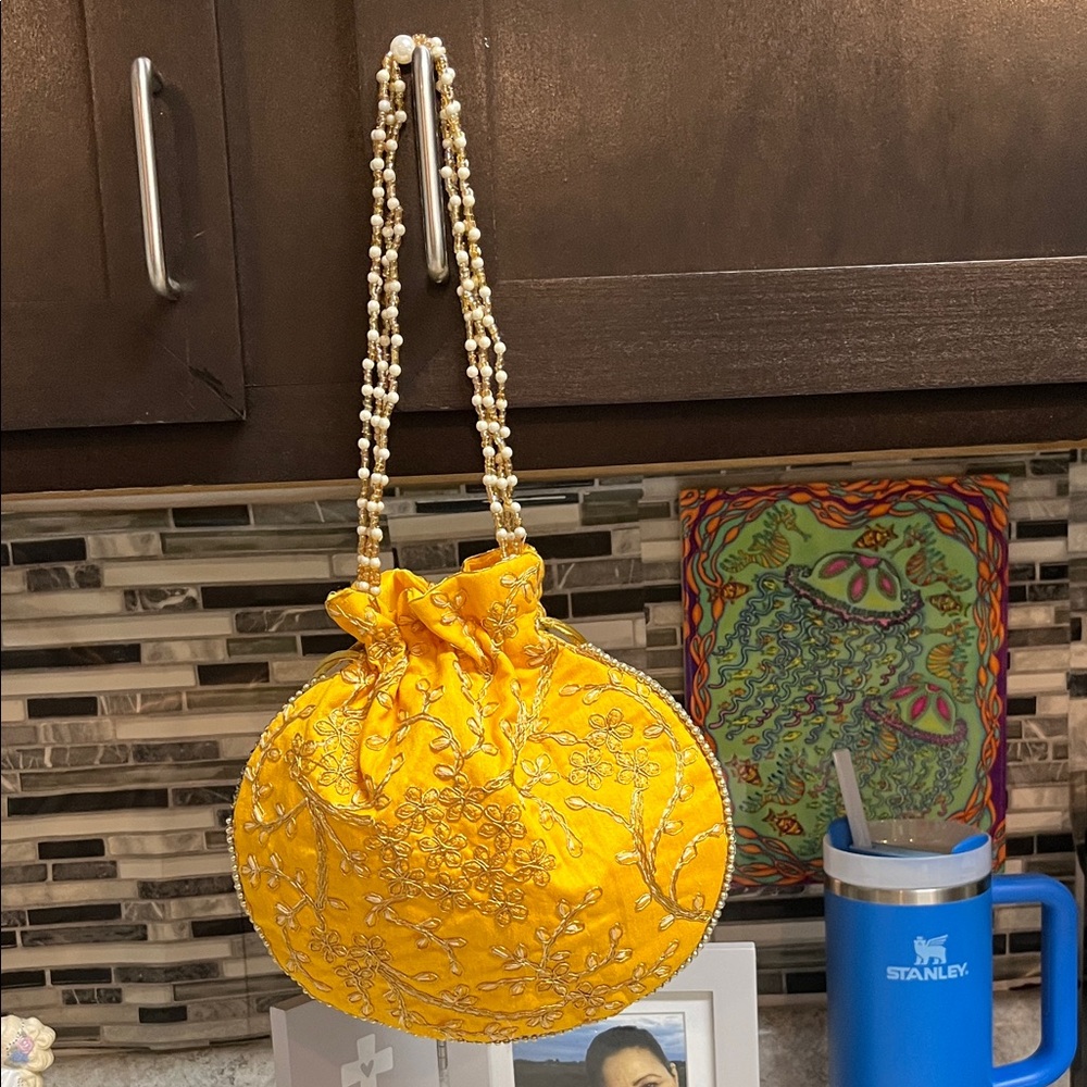 India Boutique Yellow Embroidered Beaded-Handle Drawstring Clutch